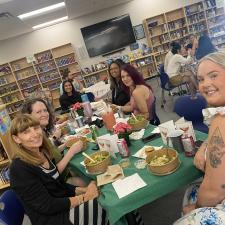 Support staff sitting at an appreciation luncheon.
